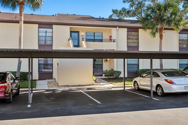 view of property with covered parking