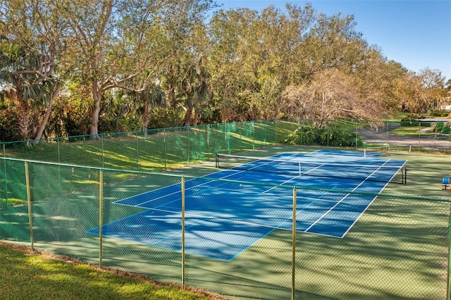 view of tennis court with fence