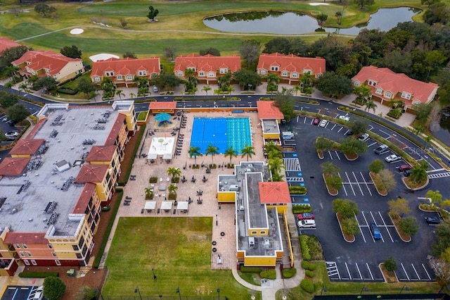 bird's eye view featuring view of golf course and a water view