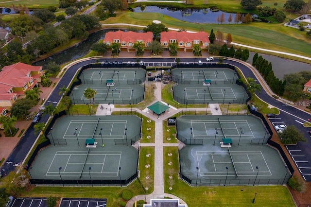 bird's eye view featuring a water view and golf course view