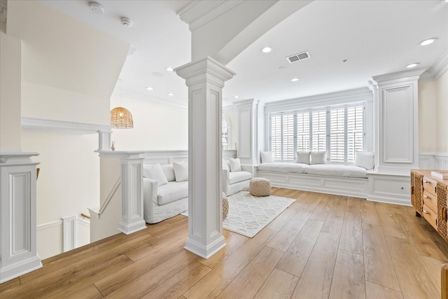 1476 Harbour Walk Rd, Tampa, FL 33602 - bathroom with decorative columns, a decorative wall, hardwood / wood-style flooring, crown molding, and a wainscoted wall