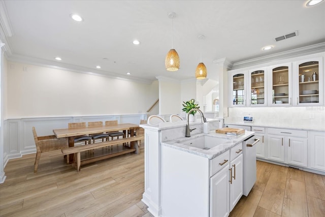 1476 Harbour Walk Rd, Tampa, FL 33602 - kitchen featuring a sink, ornamental molding, dishwasher, white cabinetry, and wainscoting