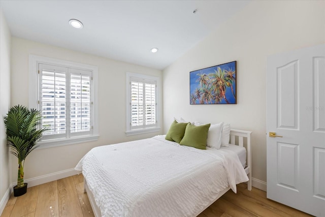 1476 Harbour Walk Rd, Tampa, FL 33602 - bedroom with baseboards, light wood-type flooring, and lofted ceiling