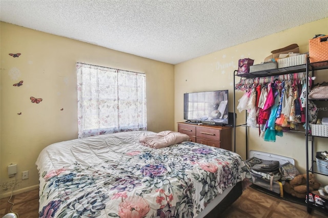 bedroom with a textured ceiling
