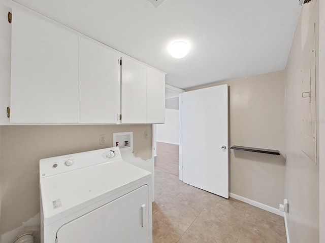 laundry room with baseboards, cabinet space, washer / clothes dryer, and light tile patterned floors