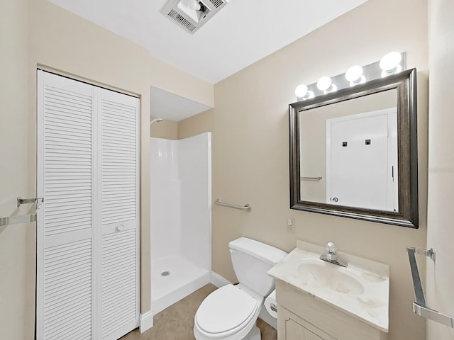 bathroom featuring visible vents, walk in shower, vanity, a closet, and toilet