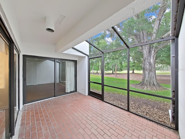 unfurnished sunroom featuring visible vents