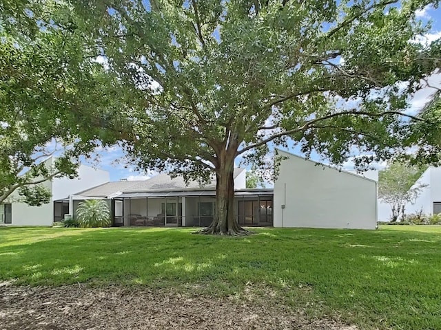 view of yard featuring glass enclosure