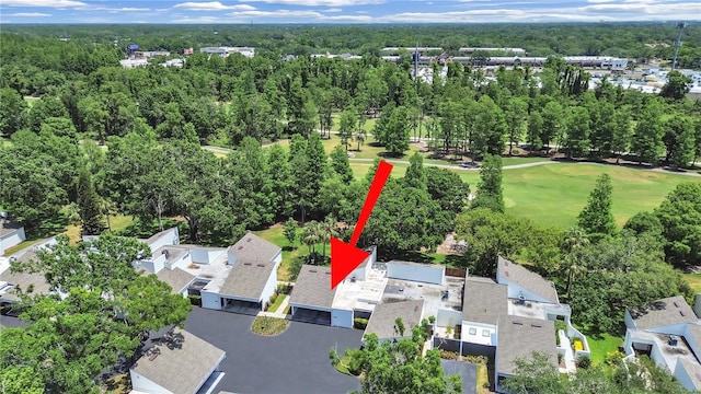 aerial view featuring a view of trees, a residential view, and golf course view