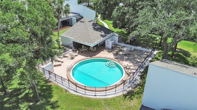 community pool with a gazebo, a lawn, fence, and a patio