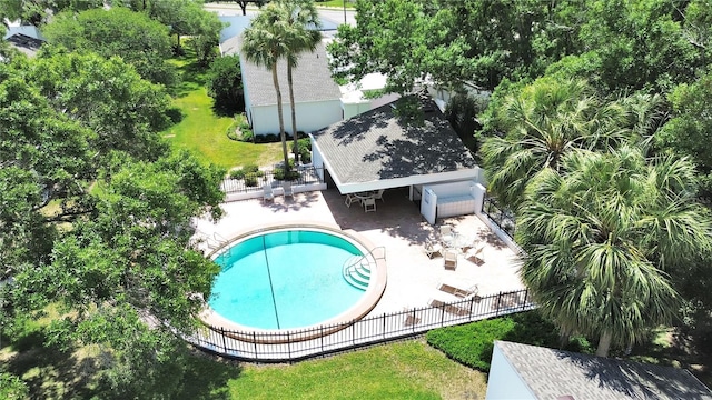 view of pool with a fenced in pool, fence, and a patio