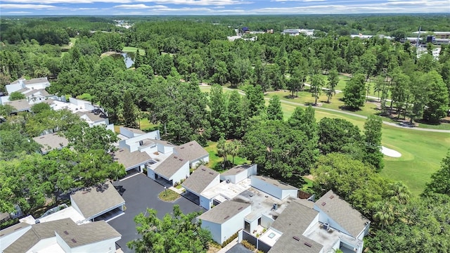 bird's eye view with view of golf course, a residential view, and a forest view