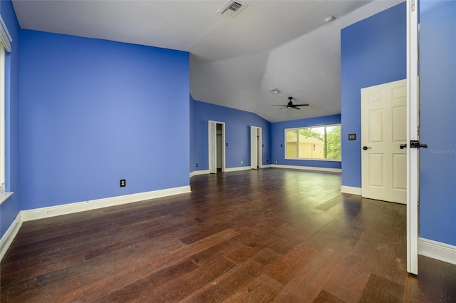 spare room with visible vents, wood finished floors, lofted ceiling, baseboards, and ceiling fan