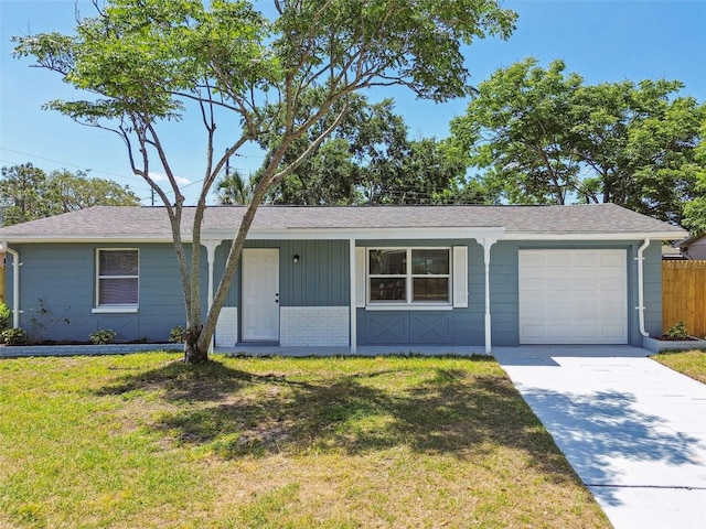 4940 Rosedale Ln, Holiday, FL 34690 - ranch-style house featuring fence, an attached garage, a front lawn, a porch, and concrete driveway