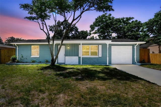 4940 Rosedale Ln, Holiday, FL 34690 - ranch-style house featuring covered porch, a garage, fence, a yard, and concrete driveway