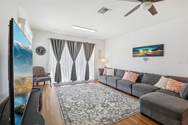 19129 Lake Audubon Dr, Tampa, FL 33647 - living area featuring ceiling fan, visible vents, and wood finished floors