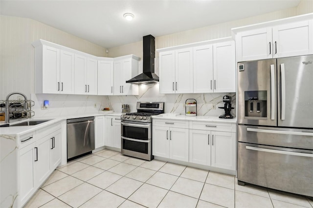 19129 Lake Audubon Dr, Tampa, FL 33647 - kitchen with wall chimney exhaust hood, white cabinetry, light stone counters, a sink, and appliances with stainless steel finishes