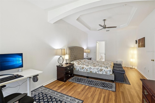 19129 Lake Audubon Dr, Tampa, FL 33647 - bedroom with baseboards, a raised ceiling, light wood-style flooring, and ceiling fan