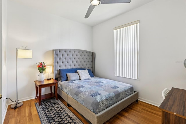 19129 Lake Audubon Dr, Tampa, FL 33647 - bedroom featuring a ceiling fan, baseboards, and wood finished floors
