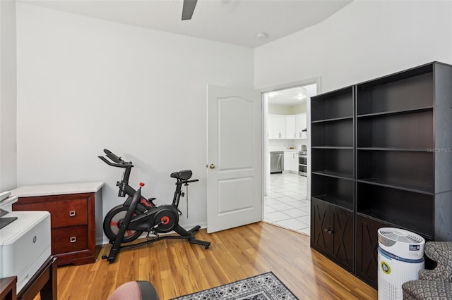 19129 Lake Audubon Dr, Tampa, FL 33647 - workout room with ceiling fan and light wood-style floors
