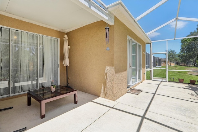 19129 Lake Audubon Dr, Tampa, FL 33647 - view of patio / terrace featuring glass enclosure