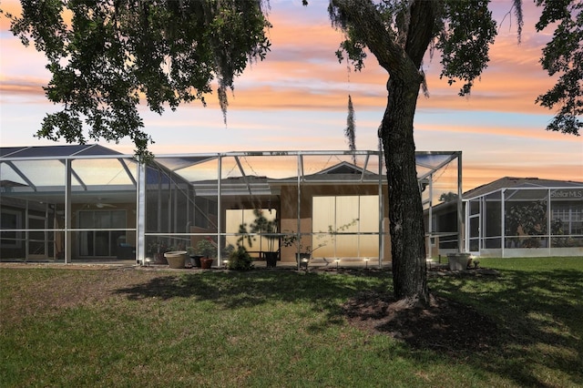 19129 Lake Audubon Dr, Tampa, FL 33647 - back of property featuring a yard and a lanai