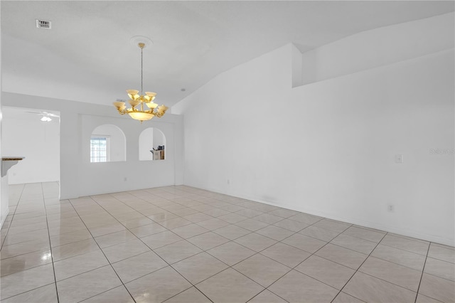4617 Horseshoe Pick Ln, Valrico, FL 33594 - spare room featuring lofted ceiling, a chandelier, and light tile patterned floors