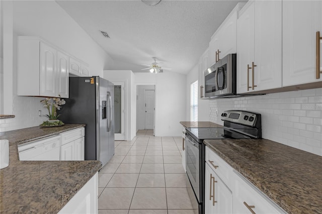4617 Horseshoe Pick Ln, Valrico, FL 33594 - kitchen featuring stainless steel appliances, a ceiling fan, white cabinets, backsplash, and vaulted ceiling