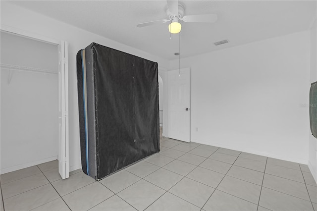 4617 Horseshoe Pick Ln, Valrico, FL 33594 - spare room with light tile patterned floors, a ceiling fan, and baseboards