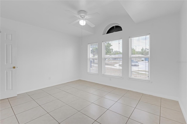 4617 Horseshoe Pick Ln, Valrico, FL 33594 - empty room featuring light tile patterned flooring, a ceiling fan, and vaulted ceiling