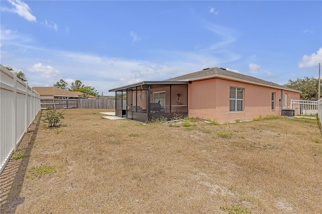 4617 Horseshoe Pick Ln, Valrico, FL 33594 - back of house with a sunroom and stucco siding