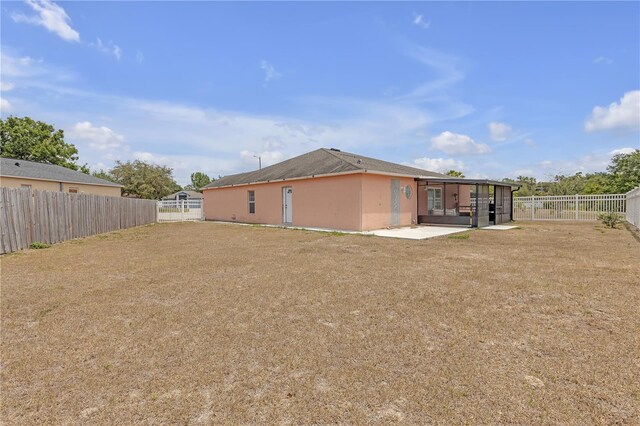 4617 Horseshoe Pick Ln, Valrico, FL 33594 - back of house featuring a patio area
