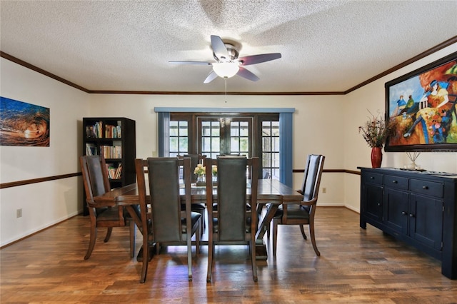 dining area with ceiling fan, dark wood finished floors, ornamental molding, and a textured ceiling