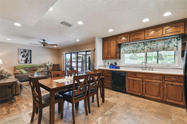 kitchen featuring light countertops, a sink, visible vents, dishwasher, and recessed lighting