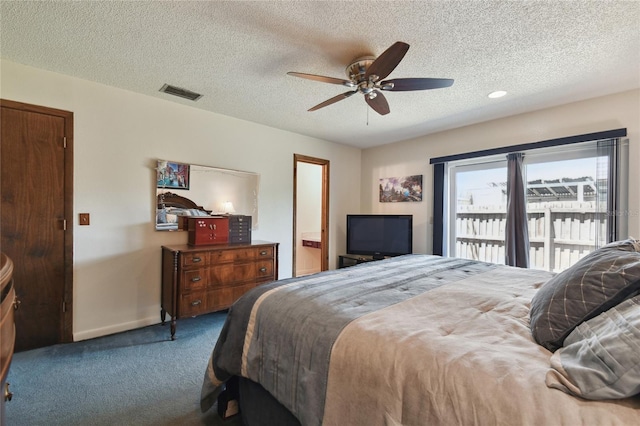 carpeted bedroom featuring a ceiling fan, a textured ceiling, baseboards, ensuite bathroom, and visible vents