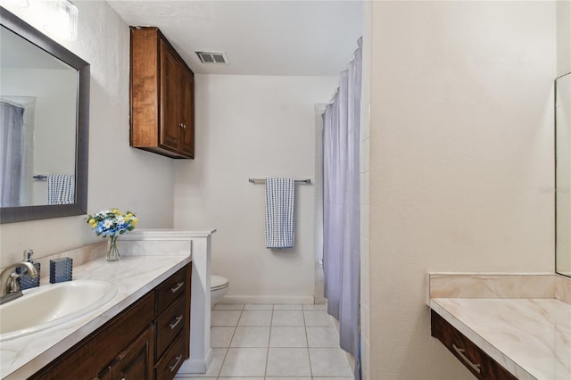 full bathroom featuring tile patterned floors, toilet, visible vents, and vanity