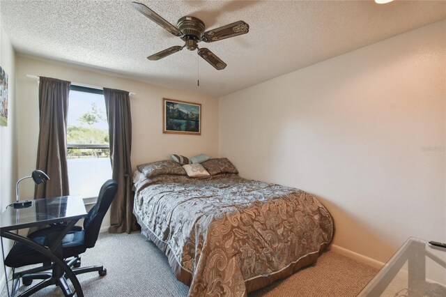 bedroom with a textured ceiling, baseboards, ceiling fan, and carpet