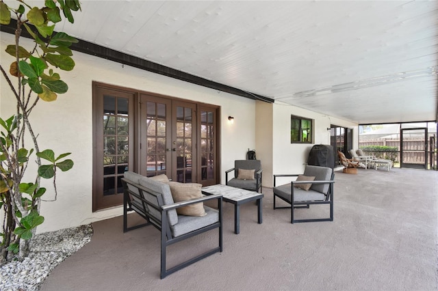 view of patio / terrace featuring french doors and fence