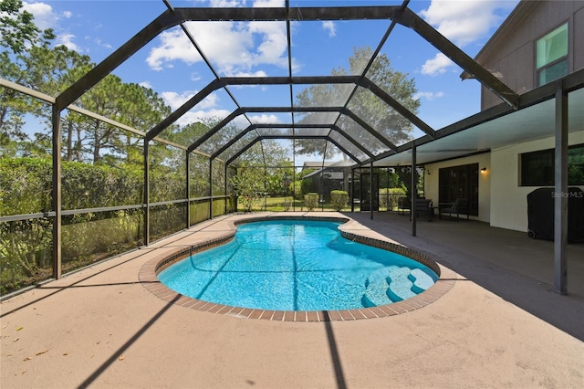 outdoor pool featuring a patio area and a lanai