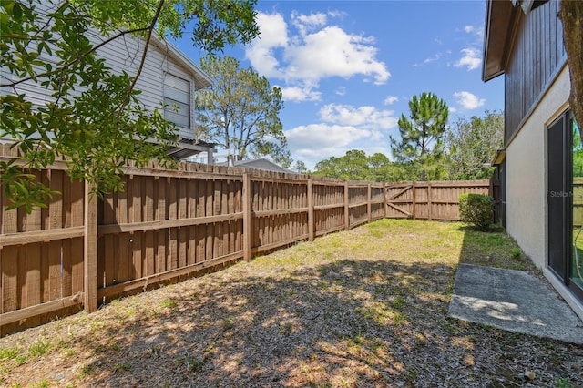view of yard with a fenced backyard