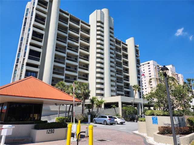 view of property featuring uncovered parking