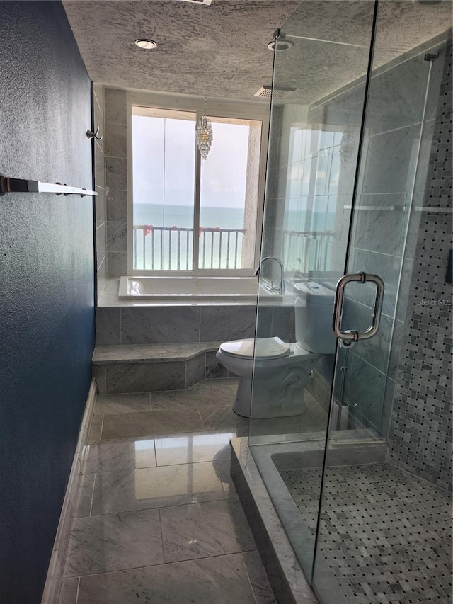 full bath with a stall shower, baseboards, and toilet