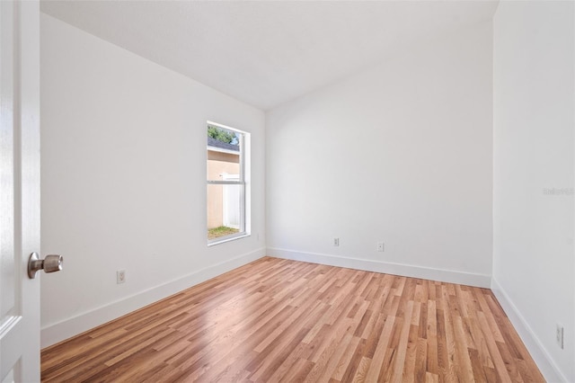 unfurnished room featuring light wood-style floors and baseboards