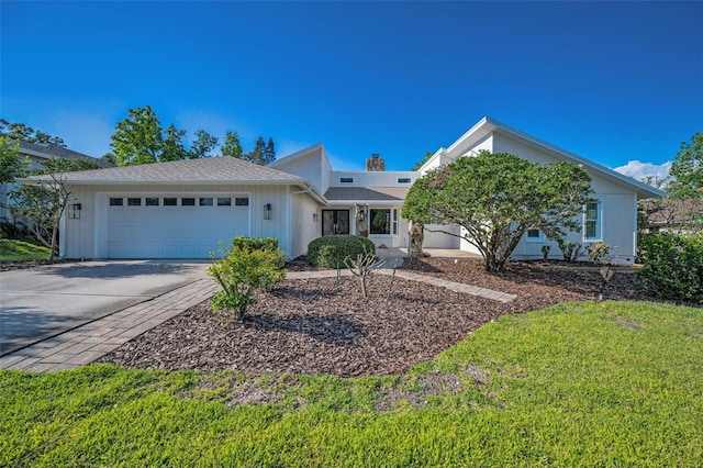 833 Lakeside Ter, Palm Harbor, FL 34683 - ranch-style home featuring an attached garage, concrete driveway, and a front yard