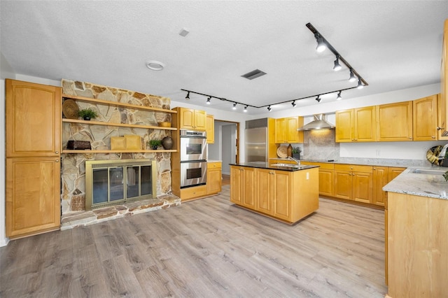833 Lakeside Ter, Palm Harbor, FL 34683 - kitchen featuring visible vents, open shelves, wall chimney range hood, light wood-style flooring, and appliances with stainless steel finishes