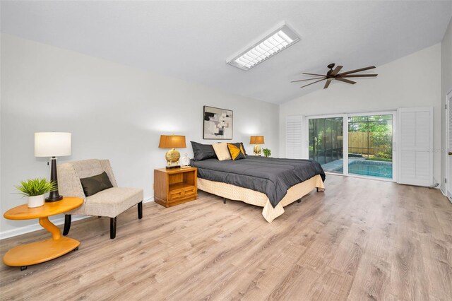 833 Lakeside Ter, Palm Harbor, FL 34683 - bedroom featuring ceiling fan, baseboards, light wood finished floors, lofted ceiling, and access to outside