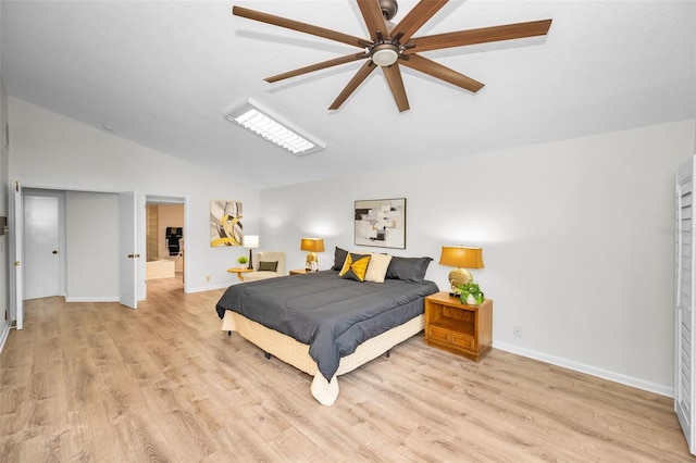 833 Lakeside Ter, Palm Harbor, FL 34683 - bedroom with ceiling fan, baseboards, vaulted ceiling, and light wood-style flooring