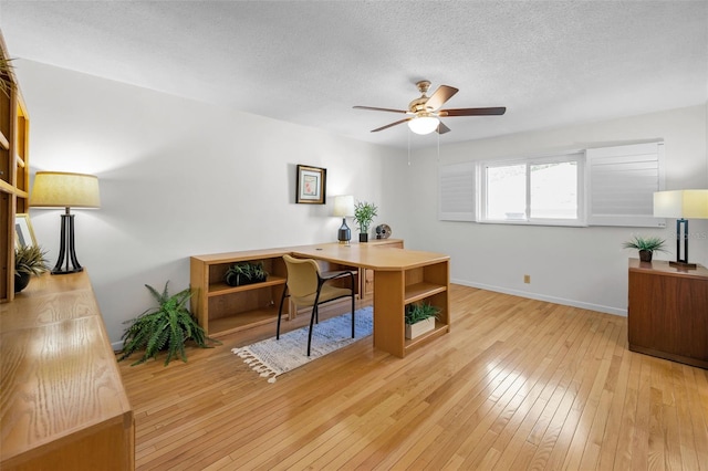 833 Lakeside Ter, Palm Harbor, FL 34683 - office with a ceiling fan, a textured ceiling, baseboards, and hardwood / wood-style floors