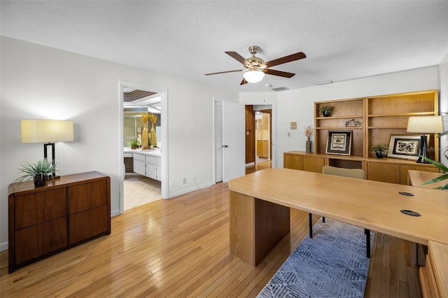 833 Lakeside Ter, Palm Harbor, FL 34683 - office with light wood-style floors, a textured ceiling, ceiling fan, and visible vents