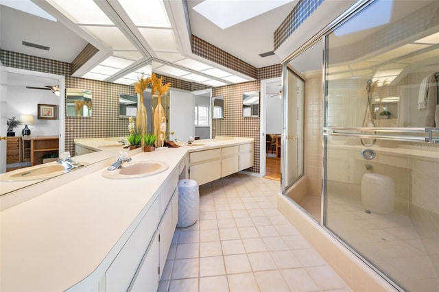 833 Lakeside Ter, Palm Harbor, FL 34683 - full bath featuring vanity, tile patterned floors, a ceiling fan, wallpapered walls, and a stall shower